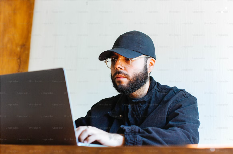 An Image of a man testing a website courtesy of Unsplash.