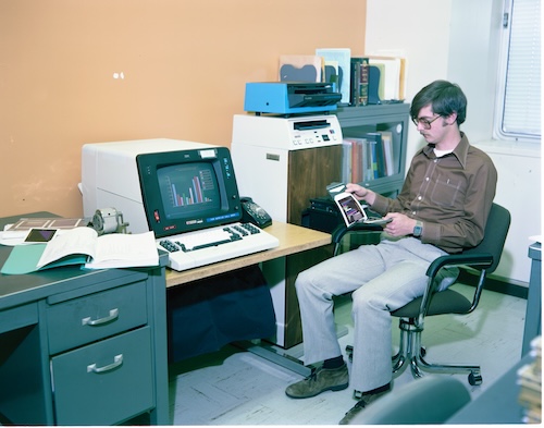 Man using 1980s computer